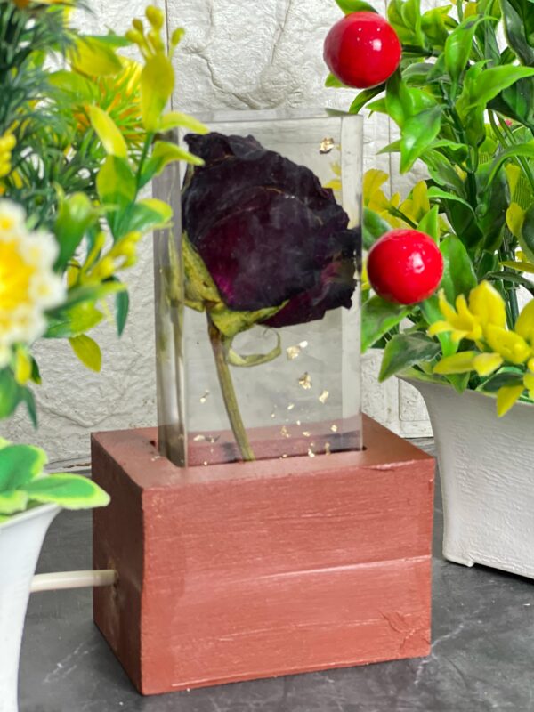 glowing resin lamp with red rose